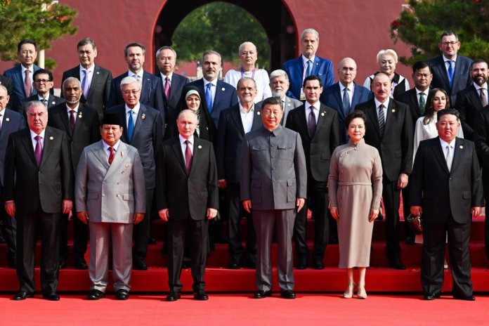Image featuring Adrian Năstase and Viorica Dăncilă in Beijing alongside Xi Jinping, Vladimir Putin, and Kim Jong Un